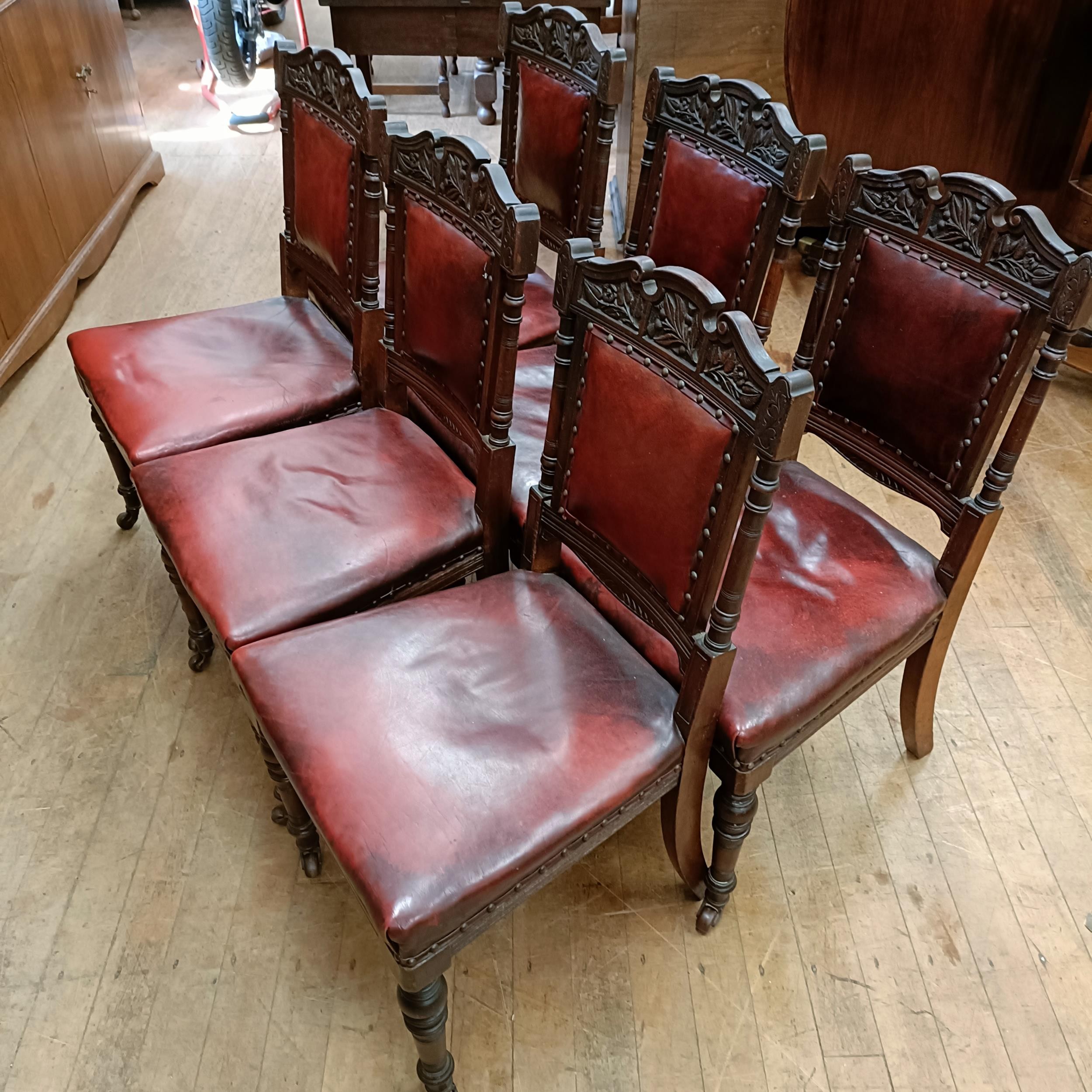 A set of six late 19th century carved walnut dining chairs, with leather padded backs and seats (6) - Image 2 of 11