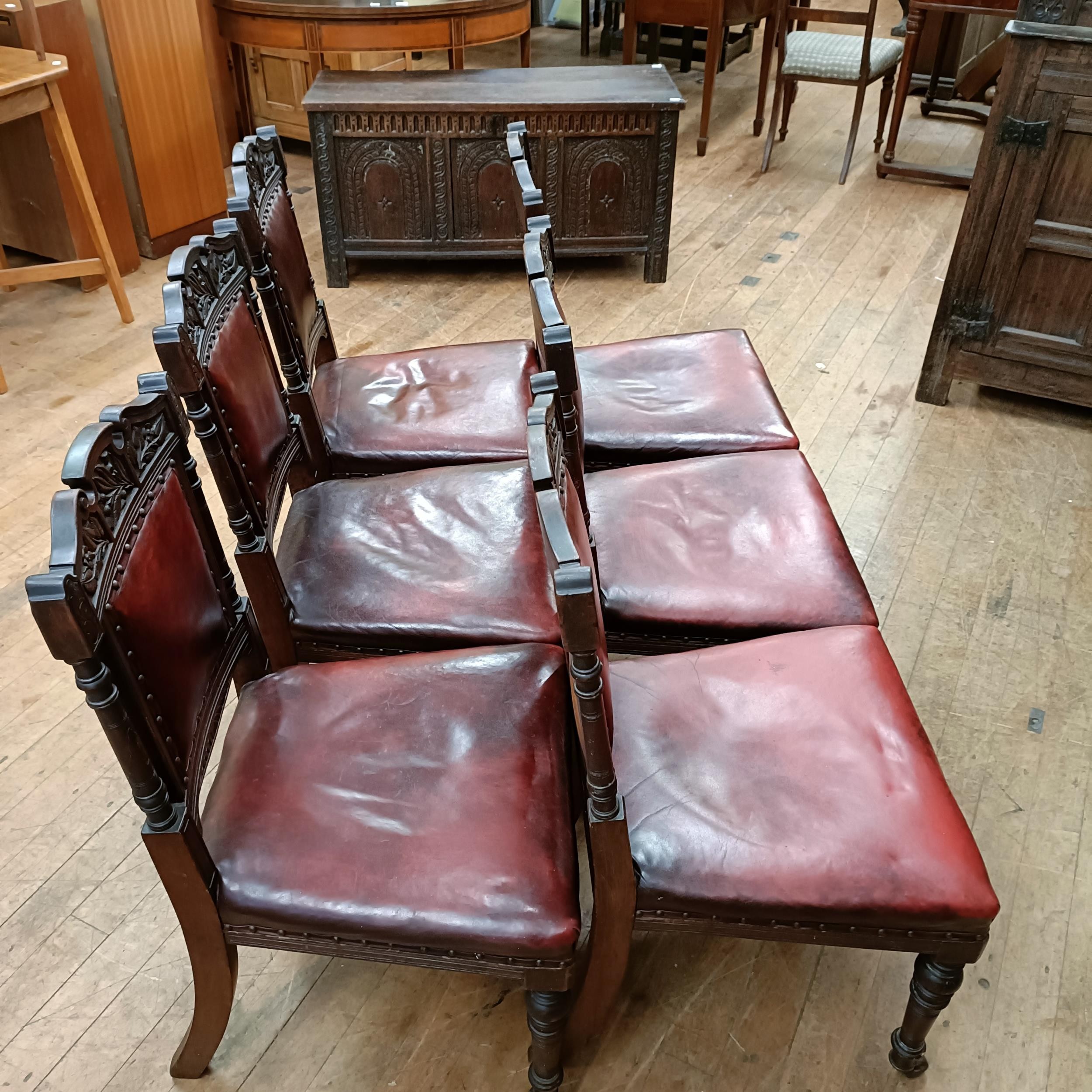 A set of six late 19th century carved walnut dining chairs, with leather padded backs and seats (6) - Image 3 of 11