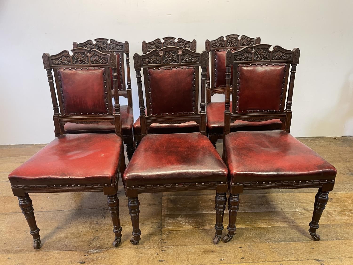 A set of six late 19th century carved walnut dining chairs, with leather padded backs and seats (6) - Image 10 of 11