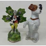 A 19th century porcelain figure of a terrier, on its hind legs, 16 cm high, and a Staffordshire