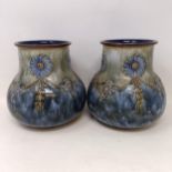 A pair of Royal Doulton vases, decorated floral forms, 17 cm high