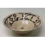 A Persian bowl, 30 cm diameter Large repair to rim, various losses