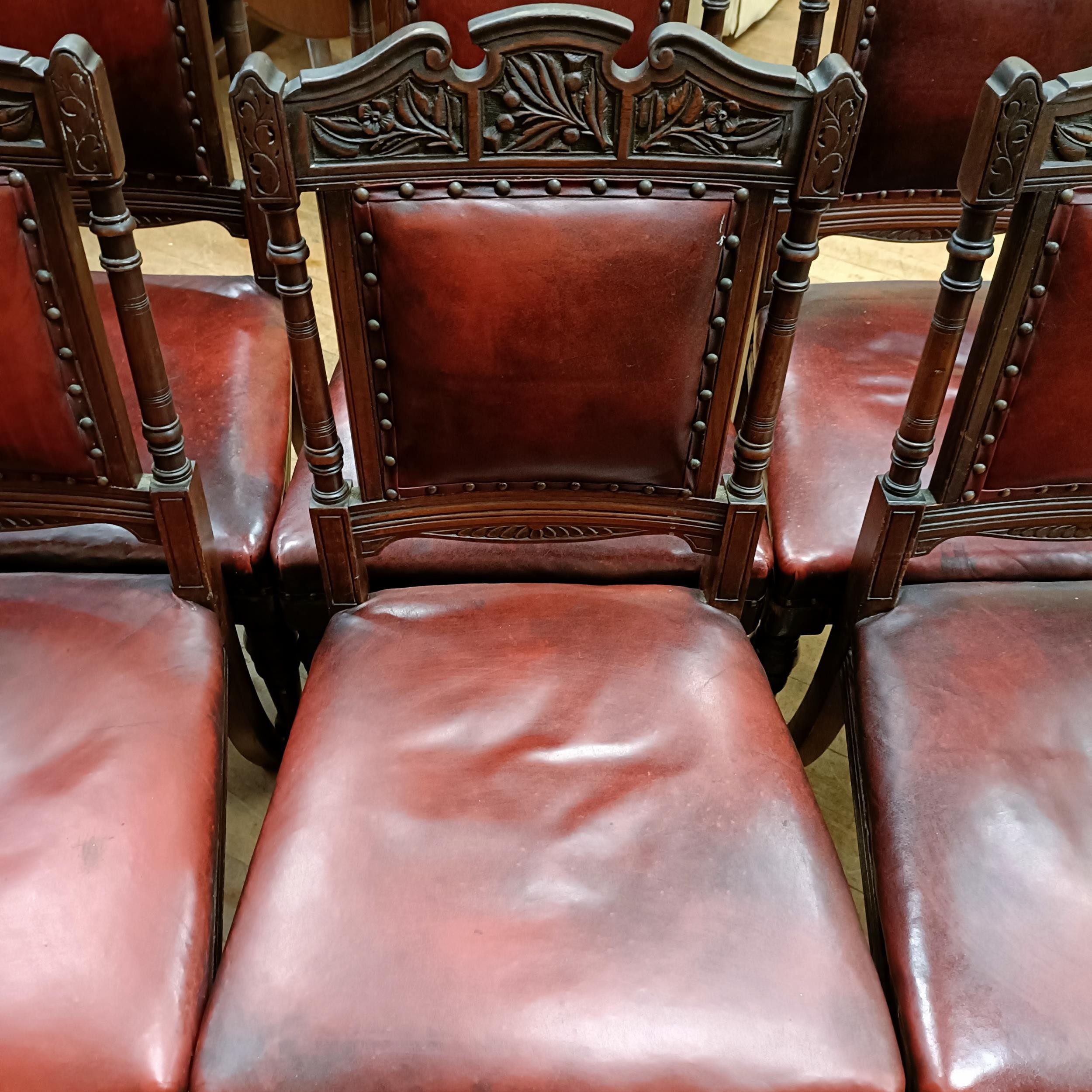 A set of six late 19th century carved walnut dining chairs, with leather padded backs and seats (6) - Image 4 of 11