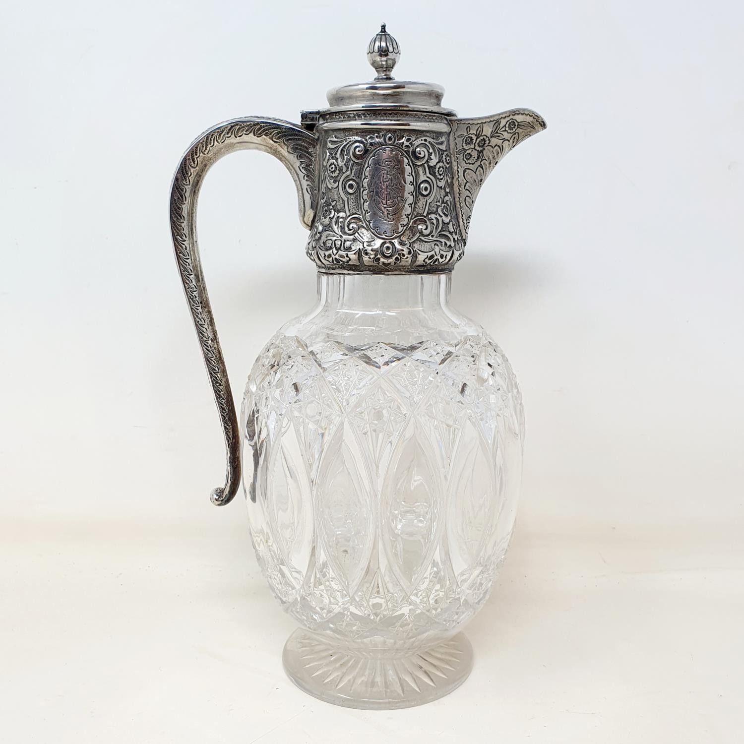 A Victorian cut glass claret jug, with a silver mount Marks rubbed, cannot see under mount but no