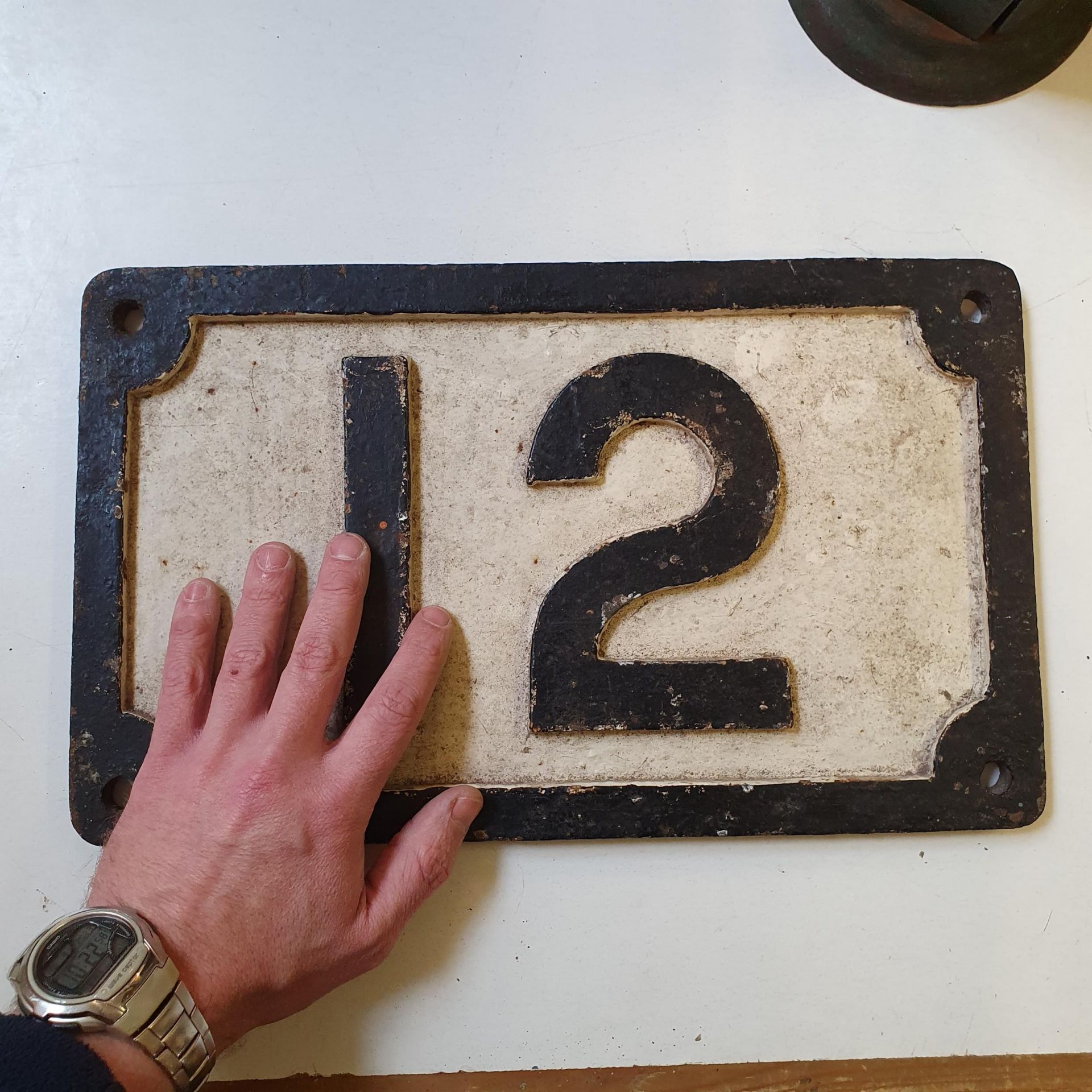 A railway painted cast iron number plate, 12, 39 x 23 cm Weathered - Image 2 of 3