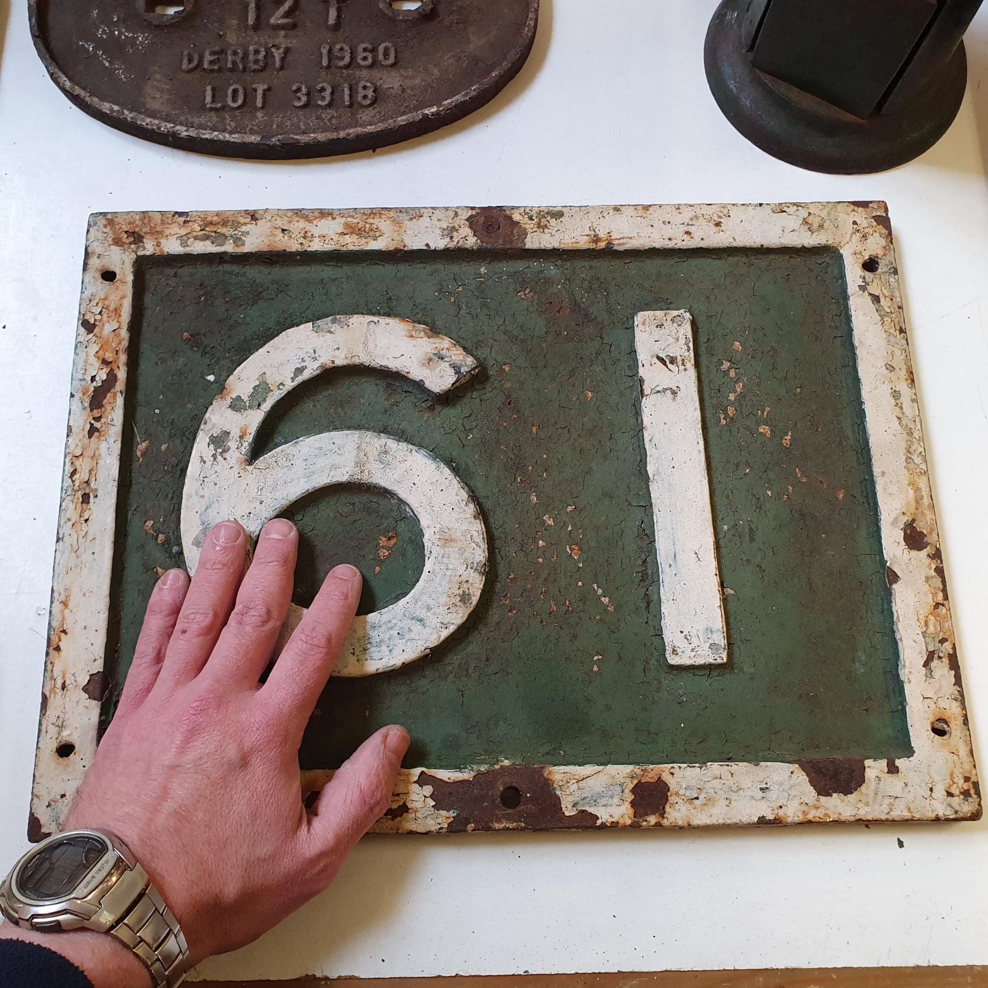 A painted cast iron locomotive/wagon number plate, 61 (or 19), 41 x 30 cm Very weathered - Image 2 of 3