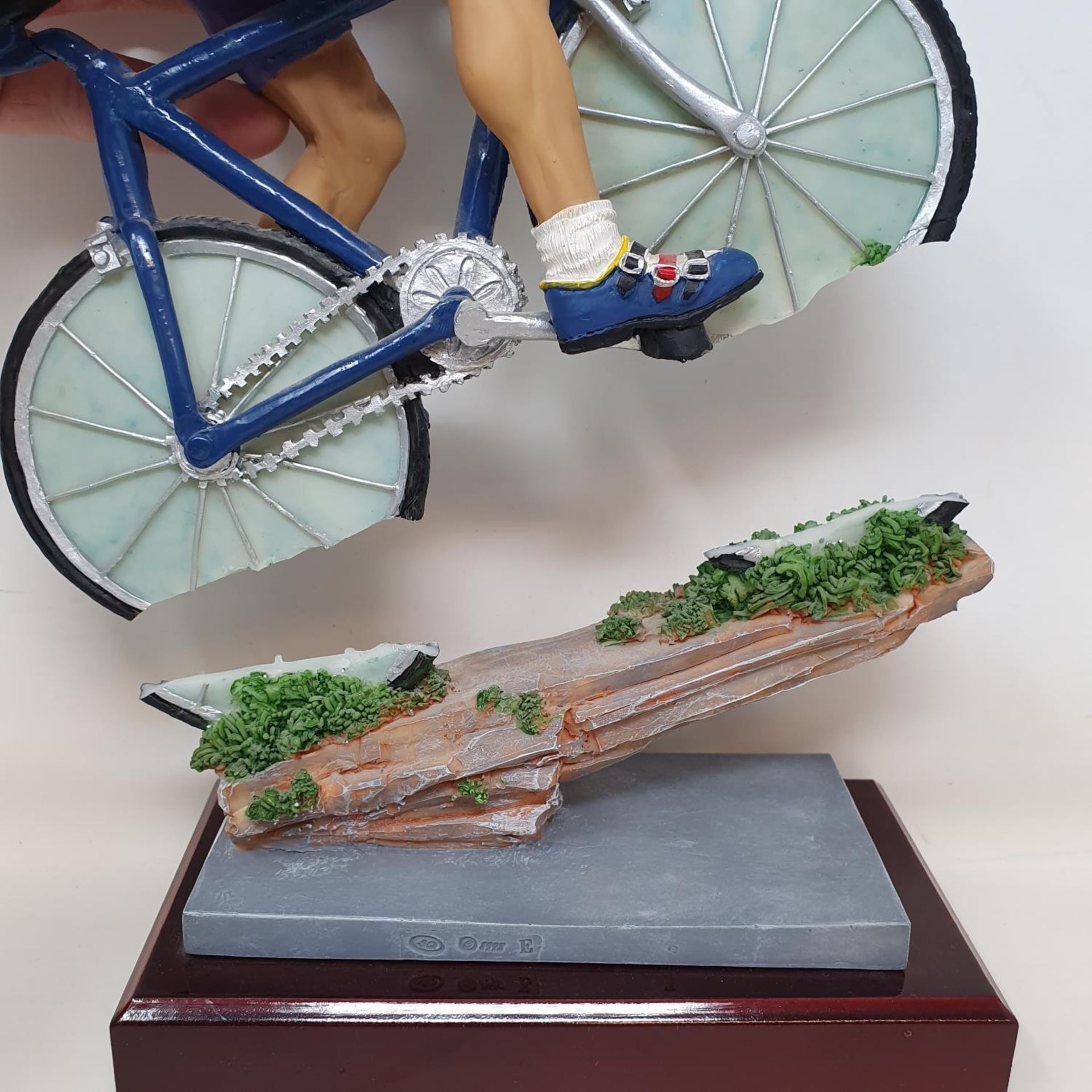 An Italian porcelain cycling trophy, 36 cm high, and a resin Hill Climb trophy in the form of a - Image 5 of 7