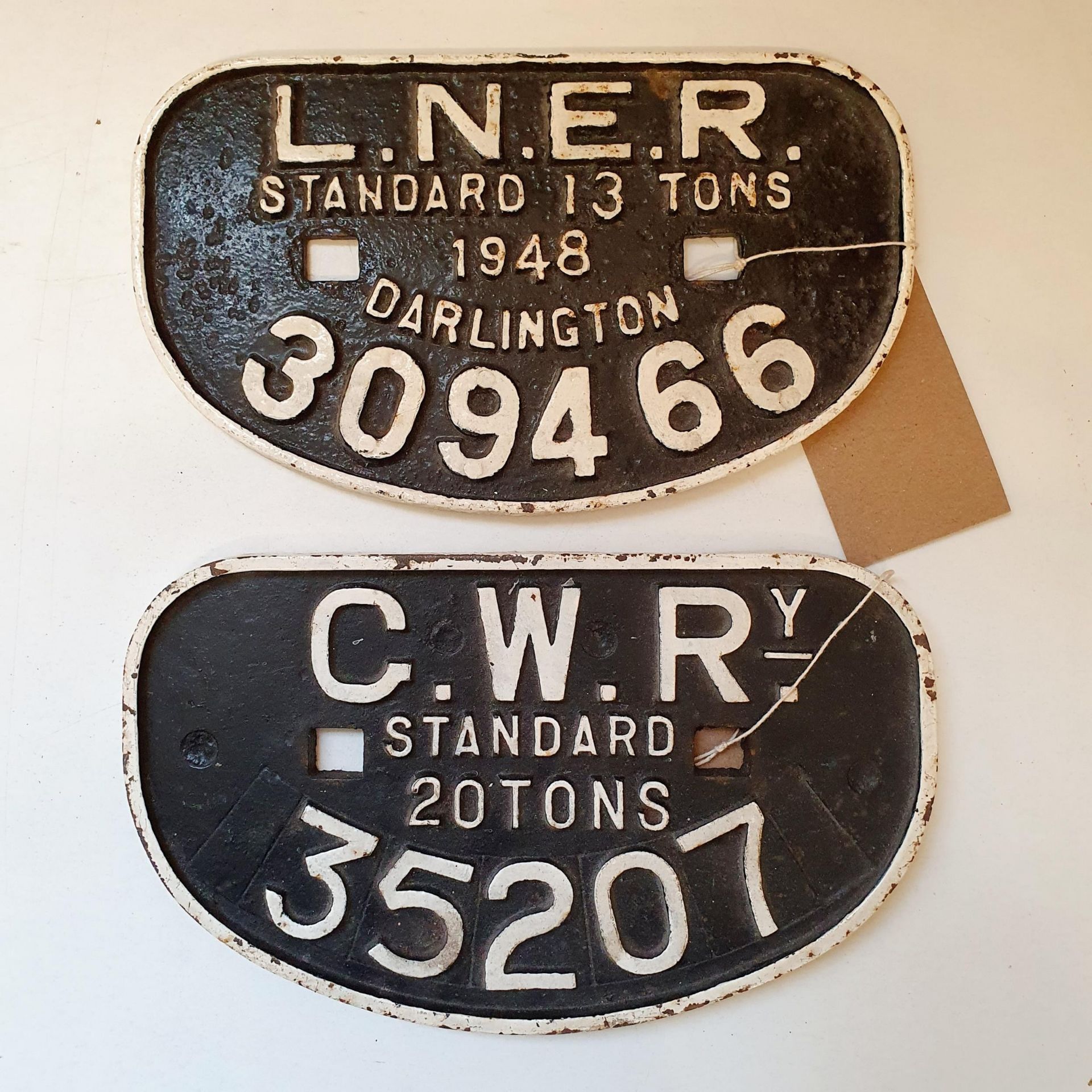 An LNER wagon cast iron plate, Standard 13 Tons, 1948, Darlington 309466, 16 x 27 cm, and another