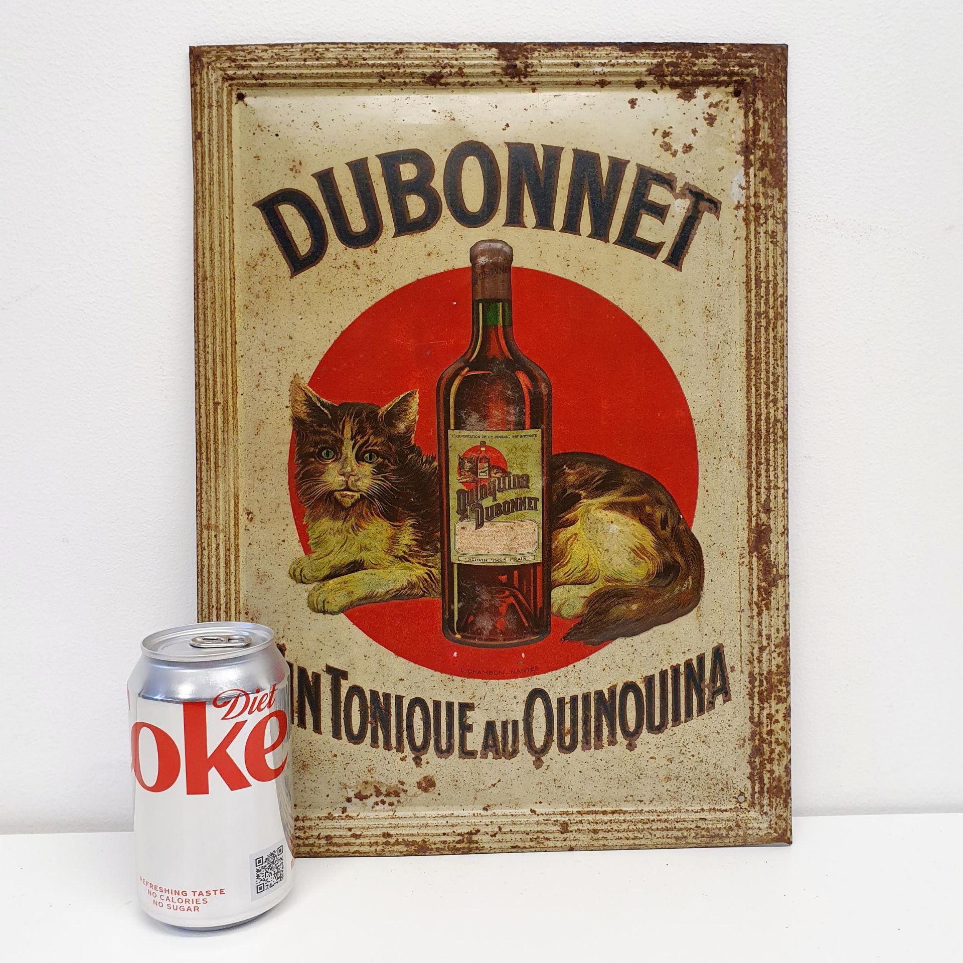 A metal sign, Dubonnet, 37 x 26 cm Quite corroded see images