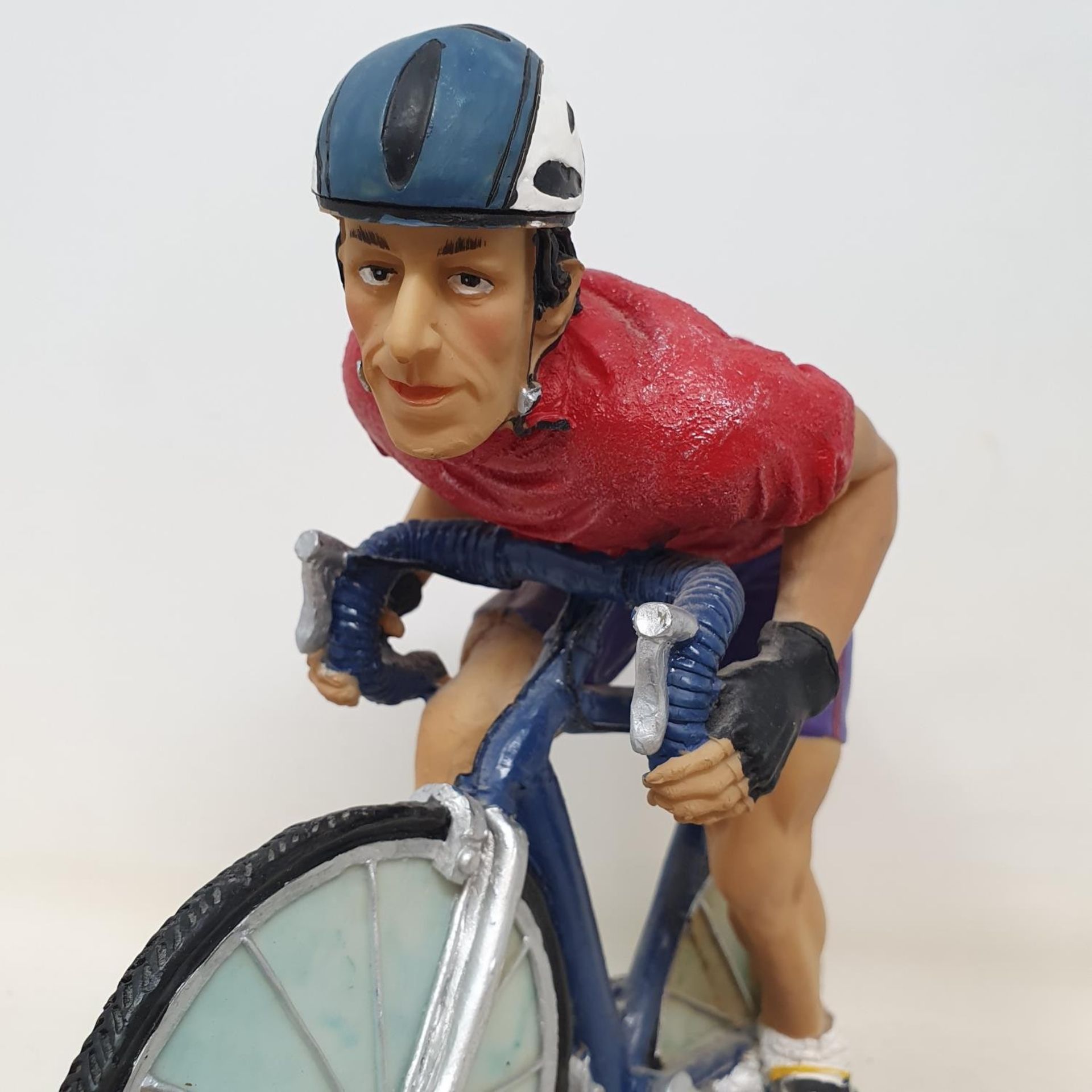 An Italian porcelain cycling trophy, 36 cm high, and a resin Hill Climb trophy in the form of a - Image 7 of 7