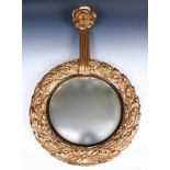 An unusual 19th century carved wood gilt framed mirror, with rose and ribbon finial, 66 cm