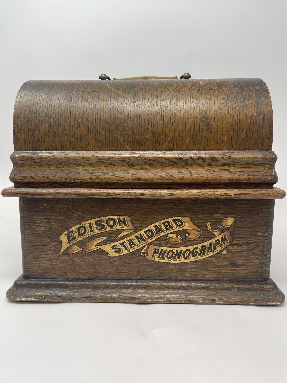 An Edison phonograph, in an oak case, assorted cylinders, a paraffin lamp, and a walking stick (4)