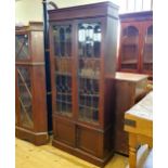 An early 20th century oak bookcase, with leaded glazed panels, 180 cm high x 92 cm wide
