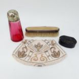 A silver and enamel mounted brush, a snuff box, a beadwork purse, and a cranberry glass sugar caster