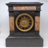 A mantel clock, with a slate dial, with Roman numerals, to a twin train eight day movement, striking