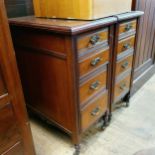 A pair of bedside chests by James Scholbred, having four drawers, 58 cm wide