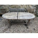 A teak garden table, 186 cm wide, a garden bench and a chair (3)