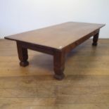 A large walnut coffee table, with a single frieze drawer, 47 cm high x 147 cm wide