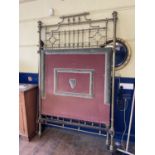 A late Victorian/Edwardian brass half tester bed, 4ft 6 inches wide