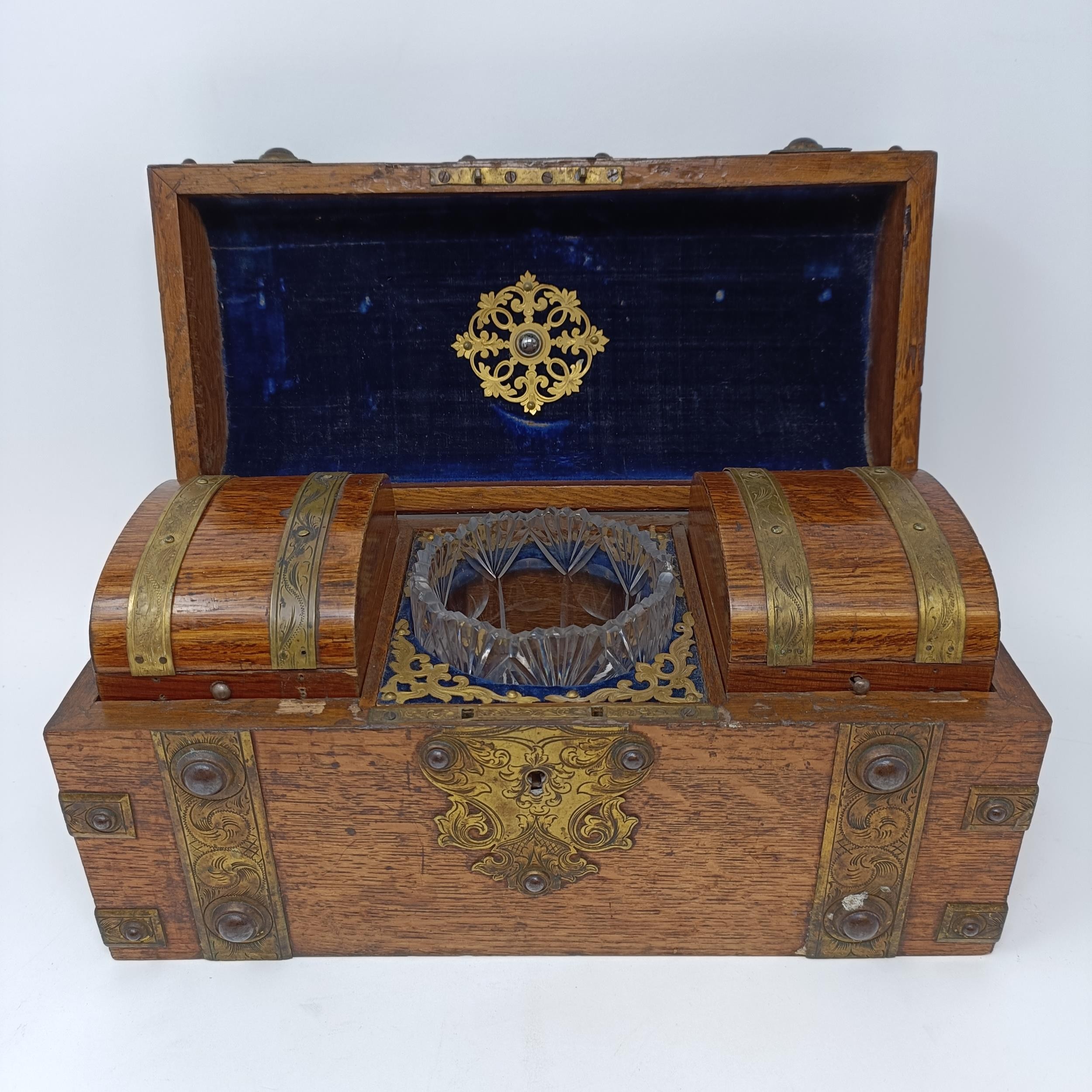 *** Withdrawn***A 19th century oak and brass bound tea caddy, with a hinge lid to reveal