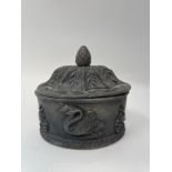 An oval tobacco box and cover, decorated swans, 14 cm wide