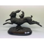 A bronze of a hare being ridden by a frog, 62 cm wide