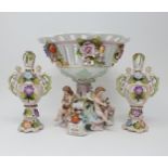 A Dresden comport, decorated cherubs, 20 cm high, a pair of vases and covers, 16 cm high, a Royal