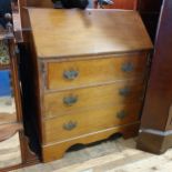 A mahogany bureau, 82 cm wide, and an oak freestanding corner cabinet, 102 cm wide (2)