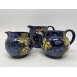 A graduated set of three jugs, decorated grapes and vines, and assorted other ceramics (4 boxes)