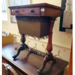 A 19th century rosewood work table, with a single frieze drawer, above a rag box, on twin end