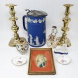 A pair of brass candlesticks, 27 cm high, a Dresden figure of a man with a dog and a sheep, and