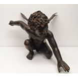 A bronze figure of a crouching cherub, 40 cm high