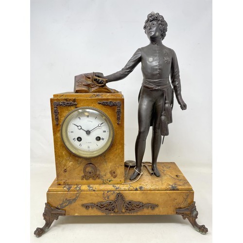 A late 19th/early 20th century French mantel clock, with an enameled 9 cm dial, with Roman numerals,