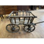 A late 19th/early 20th century dog cart, with a label reading Karl Thomas, Dresden, N30, Rietzstr.54