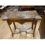 An Eastern inlaid card table, 79 cm wide