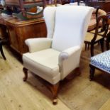 A wingback armchair, and two armchairs (3)