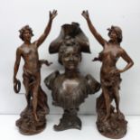 A bronzed bust, of a woman in a hat, 23 cm high, and a pair of spelter figures, 53 cm high (3)