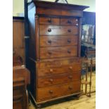 A mahogany chest on chest, the top having two short and three long drawers, on a base with three