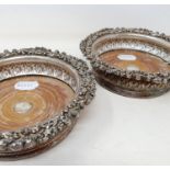 A pair of silver plate bottle coasters, 16 cm diameter