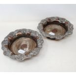 A pair of Old Sheffield silver plate bottle coasters, 19 cm wide