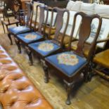 A set of four Queen Anne style walnut framed dining chairs, with drop in tapestry padded seats (4)