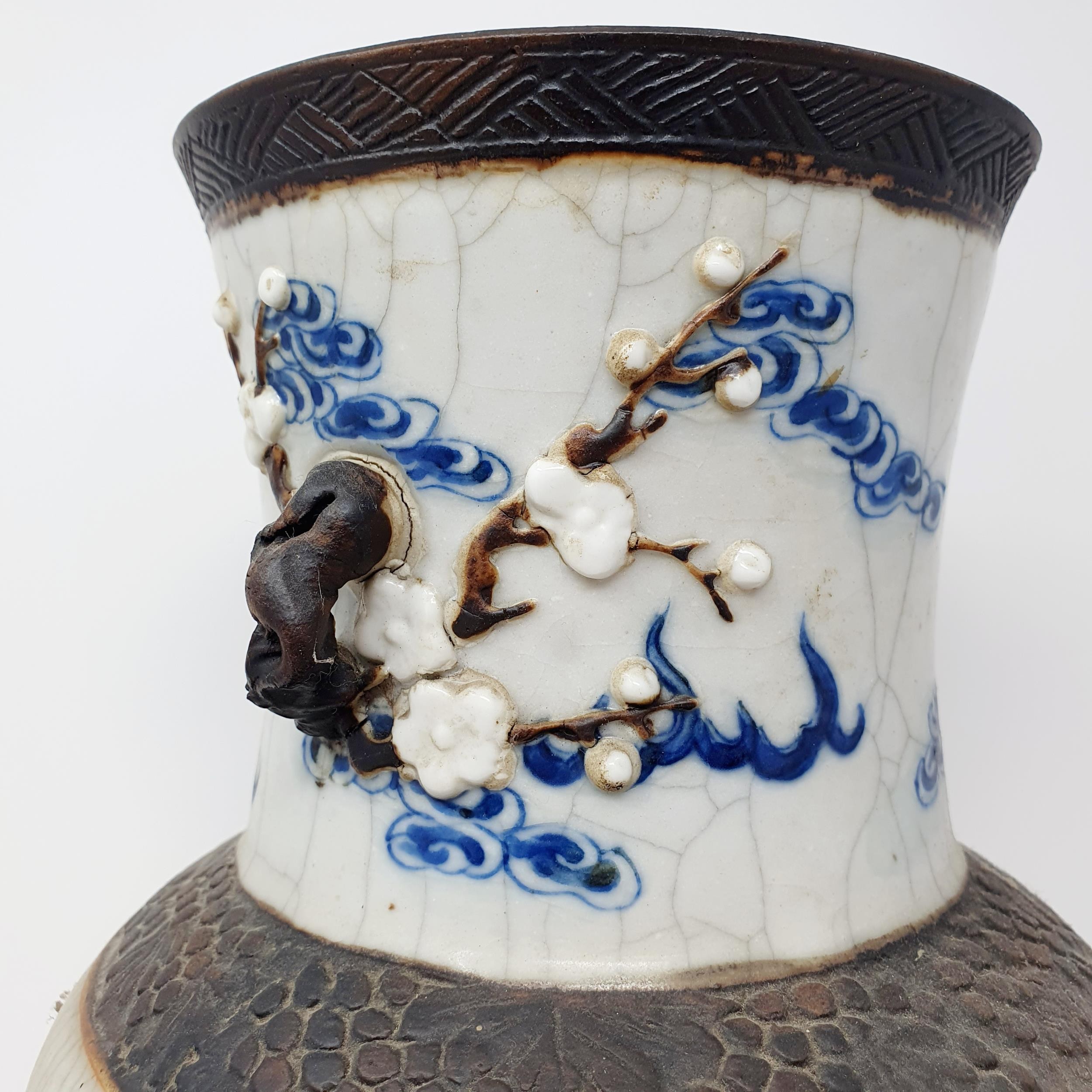 A Chinese underglazed blue and white vase, with a crackled glaze, decorated mythical beasts, 38 cm - Image 3 of 10