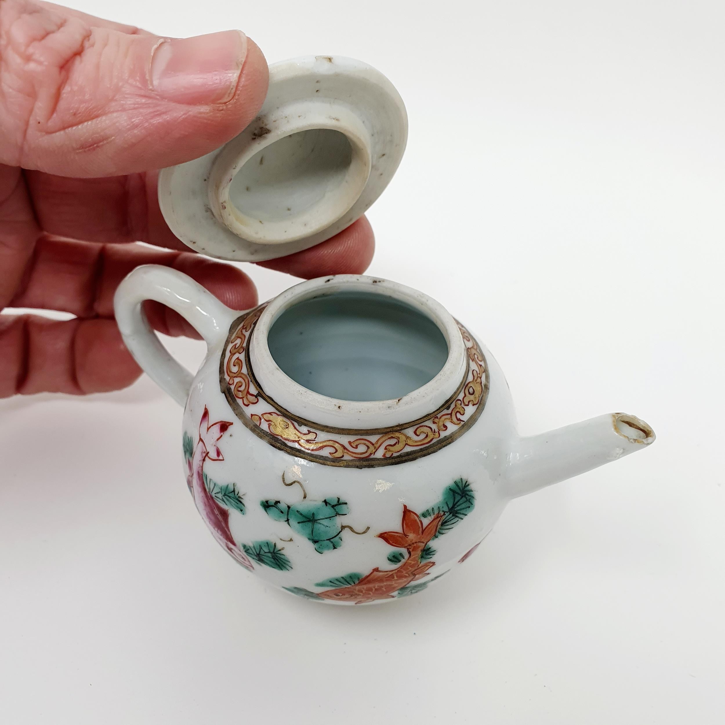 A Chinese porcelain famille rose miniature teapot and cover, decorated carp, 7 cm high The cover: - Image 3 of 4