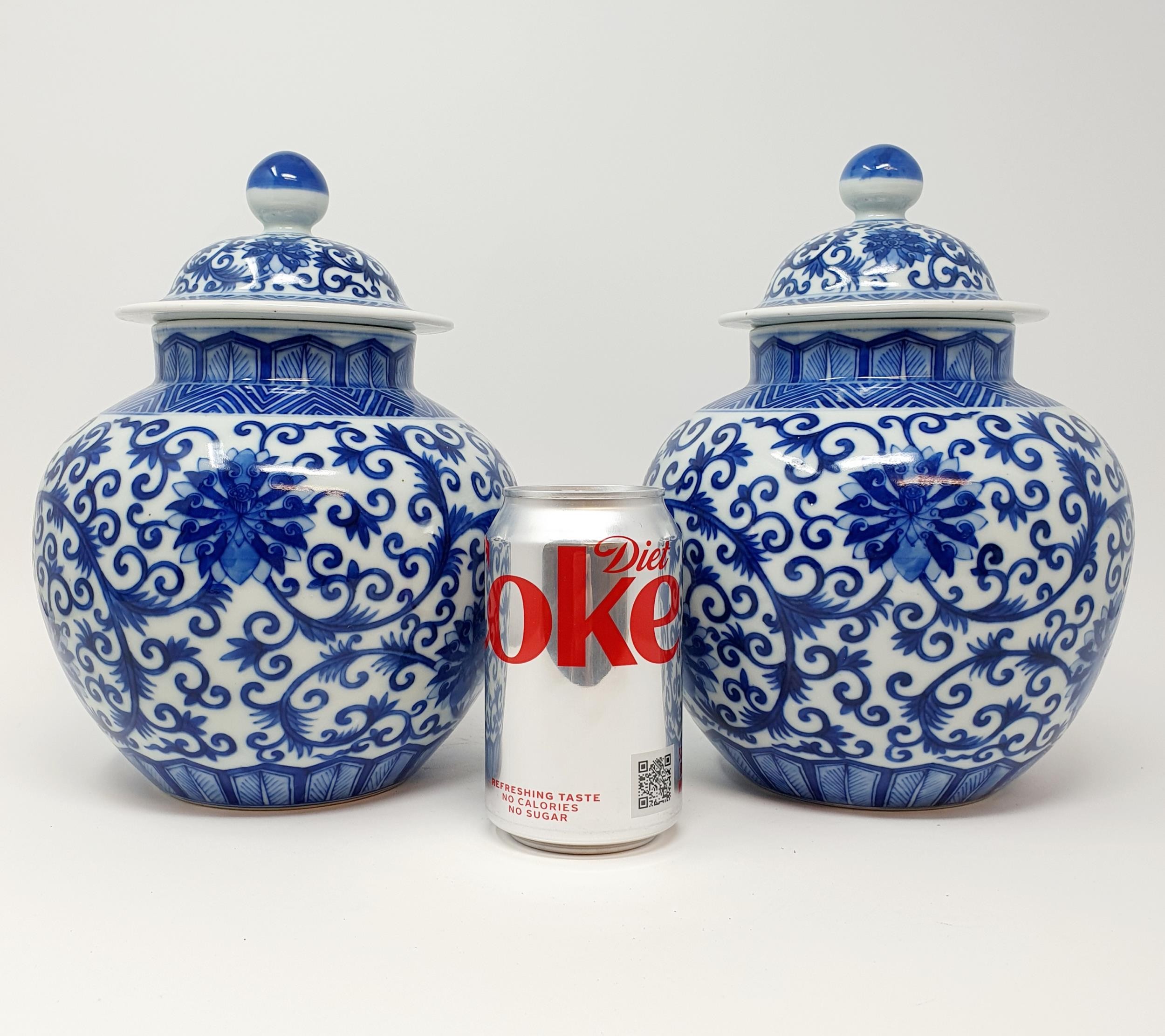 A pair of Chinese underglazed blue and white vases and covers, decorated foliate forms, six - Image 3 of 6