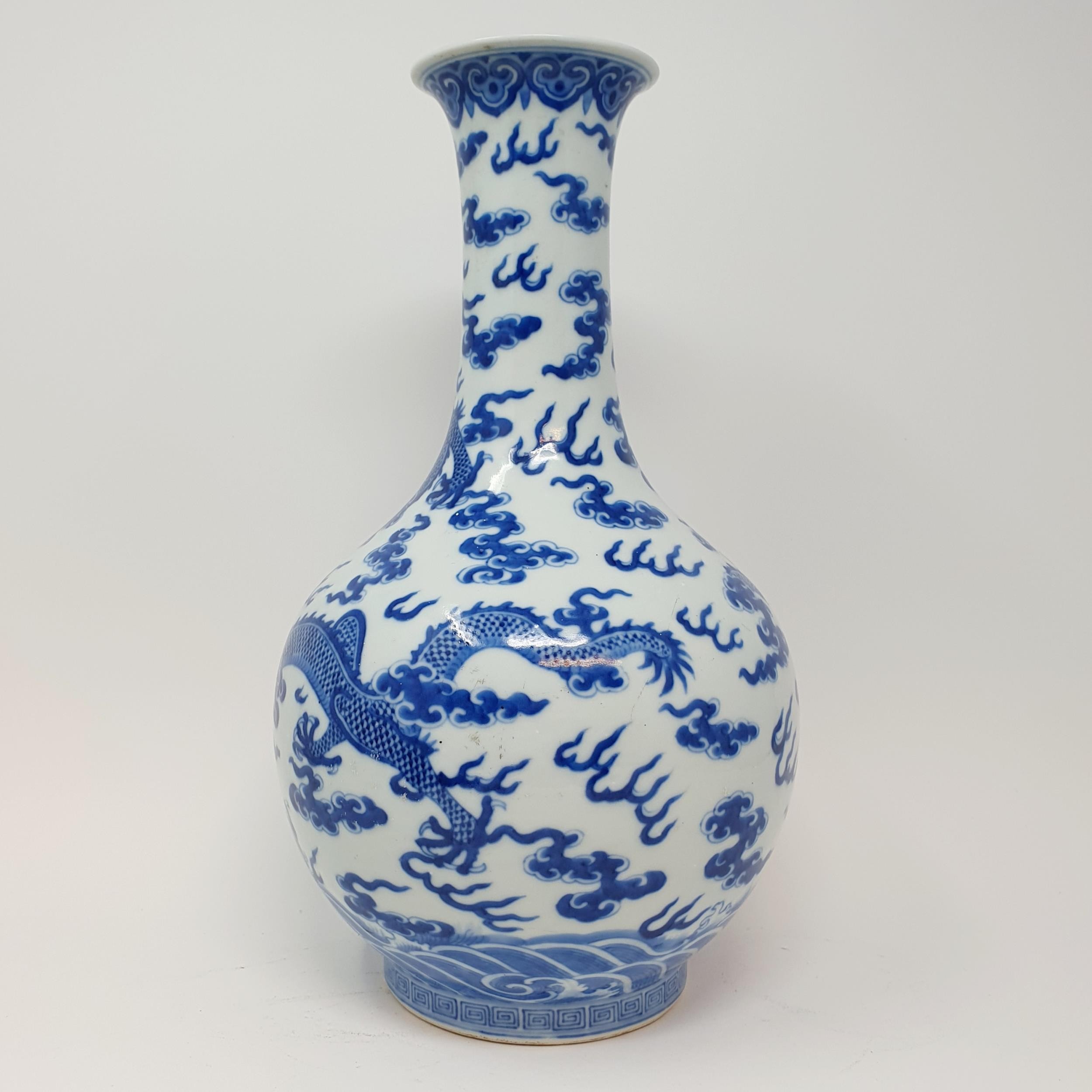 A Chinese underglazed blue and white vase, decorated dragons, 35 cm high Some firing faults, a - Image 4 of 10