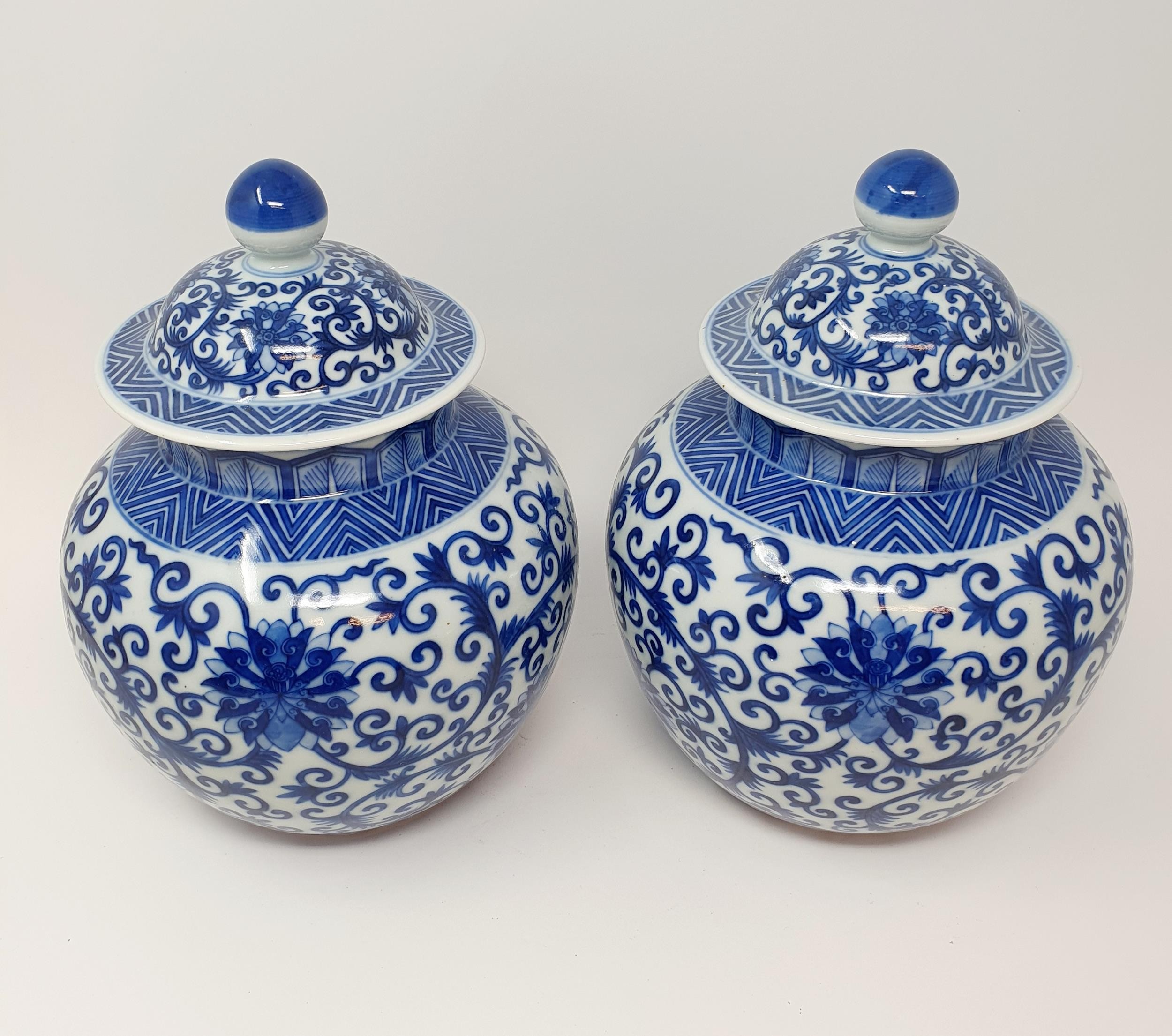 A pair of Chinese underglazed blue and white vases and covers, decorated foliate forms, six - Image 2 of 6