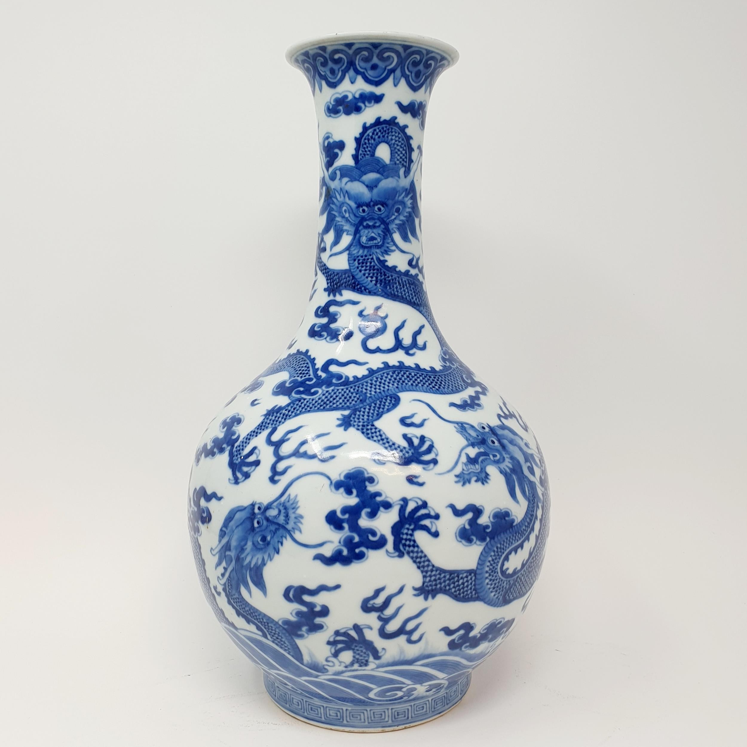 A Chinese underglazed blue and white vase, decorated dragons, 35 cm high Some firing faults, a - Image 2 of 10