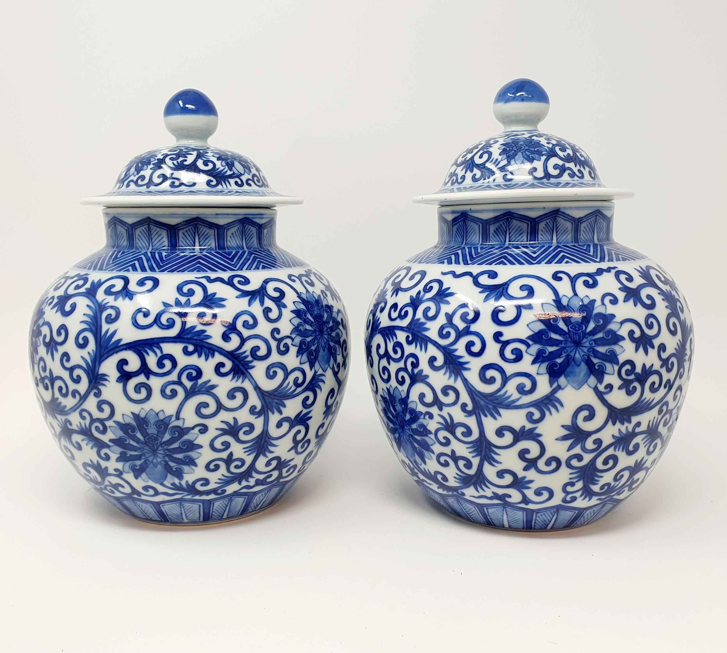 A pair of Chinese underglazed blue and white vases and covers, decorated foliate forms, six - Image 4 of 6