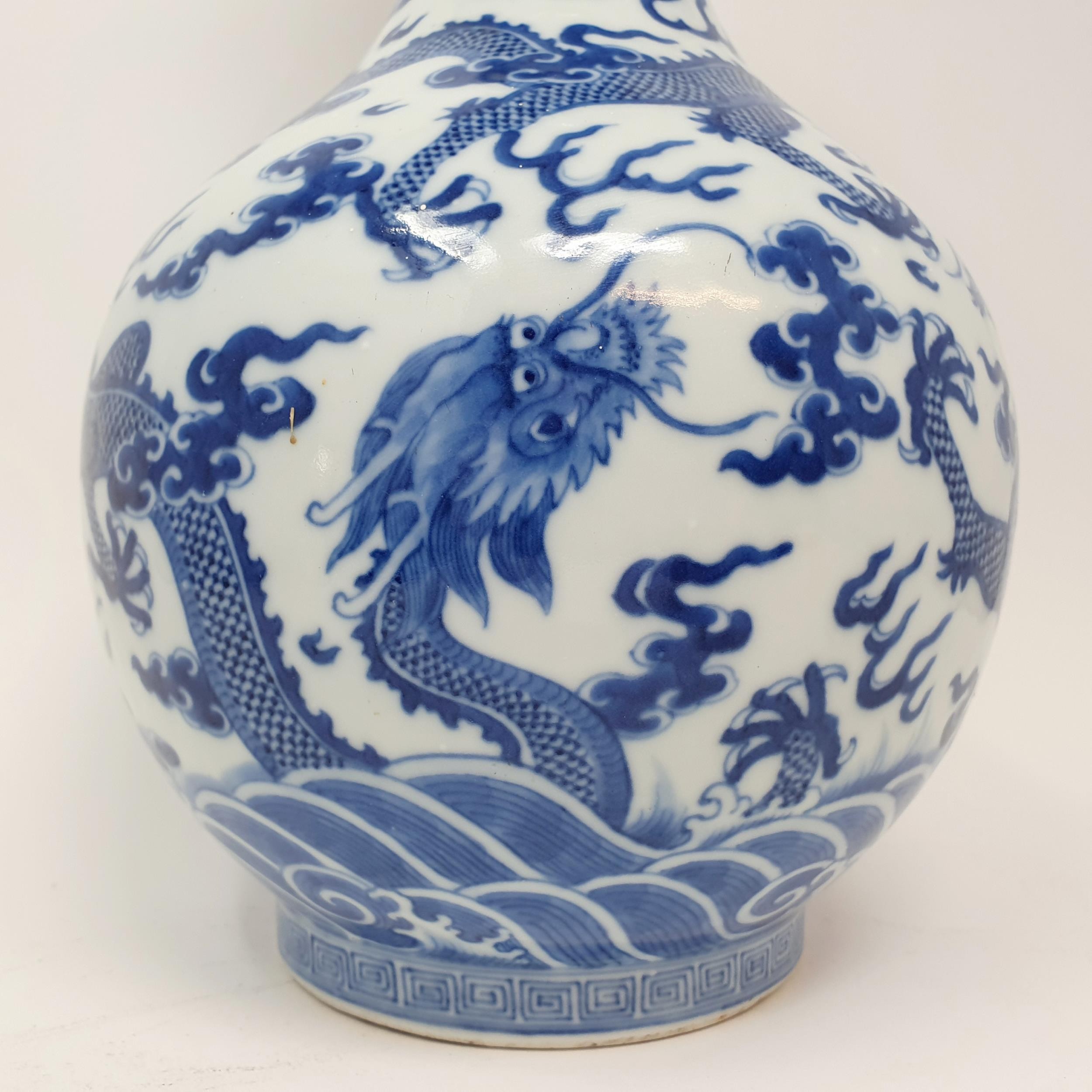A Chinese underglazed blue and white vase, decorated dragons, 35 cm high Some firing faults, a - Image 6 of 10