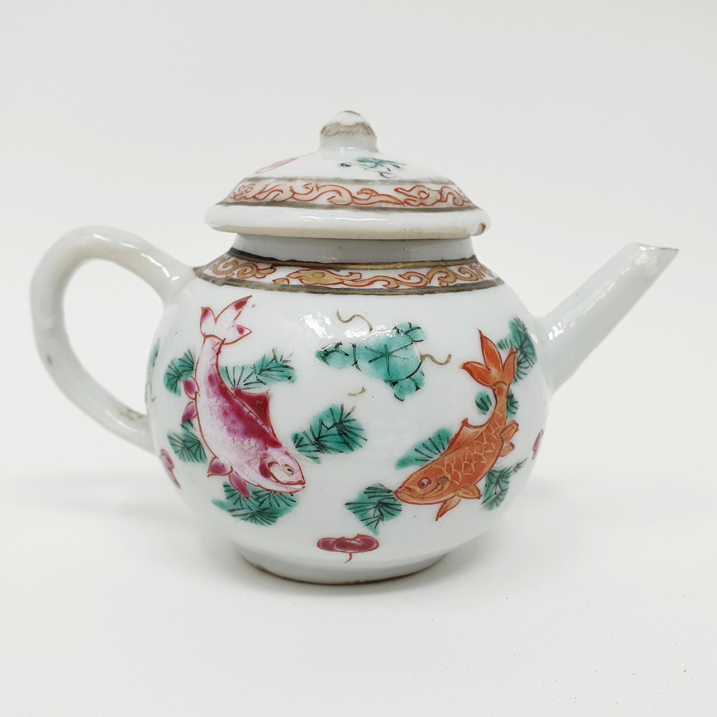 A Chinese porcelain famille rose miniature teapot and cover, decorated carp, 7 cm high The cover: - Image 2 of 4